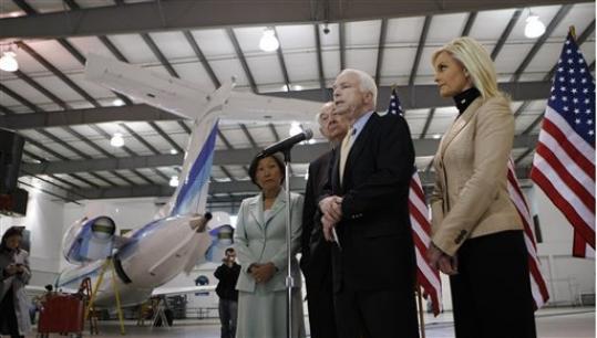 Republican presidential hopeful, Sen. John McCain, R-Ariz., speaks at a press availability in Phoenix, Ariz. Monday, March 3, 2008. With him are his wife Cindy McCain, right, former Sen. Phil Gramm, R-Texas, and his wife Wendy, left center.