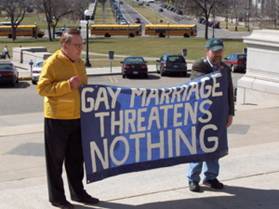 http://www.thoughttheater.com/upload/2006/09/rally%2520banner%2520gay%2520marriage%2520threatens%2520nothing.jpg