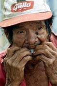 Jose Peralta, 83, a Nicaraguan former 
banana plantation worker who claims her 
health problems were caused by exposure 
to the Nemagon insecticide, eat during a 
protest in front of Parliament in 
Managua, February 24, 2004. Hundred  
former banana plantation workers who 
claim their problems such as sterility 
and cancer were caused by Nemagon used 
by Dole Food Company on their banana 
plantations in Nicaragua in the 1970's, 
is protesting to pressure their 
government to help them in obtaining 
reparations from Dole. REUTERS/Oswaldo 
Rivas