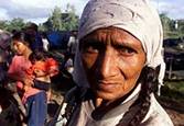Nicarguan Maria Artola waits for food 
during a  march  along the highway 
leading to Matagalpa, August 6, 2003, 
some 63  miles north of the capital 
Managua. Thousands of peasants 
participated in a march toward Managua 
to demand more land, health and work 
benefits from the government of 
President Enrique Bolanos. REUTERS/
Oswaldo Rivas   
PP03080040