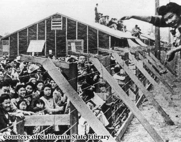 http://esjay07.files.wordpress.com/2010/12/japanese-internment.jpg