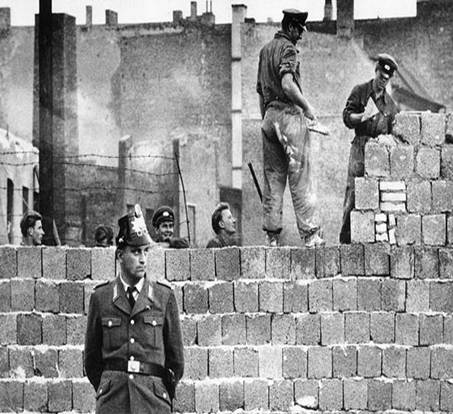 http://i2.mirror.co.uk/incoming/article146039.ece/ALTERNATES/s615/workmen-add-blocks-to-the-berlin-wall-in-1961-pic-ap-738429710.jpg